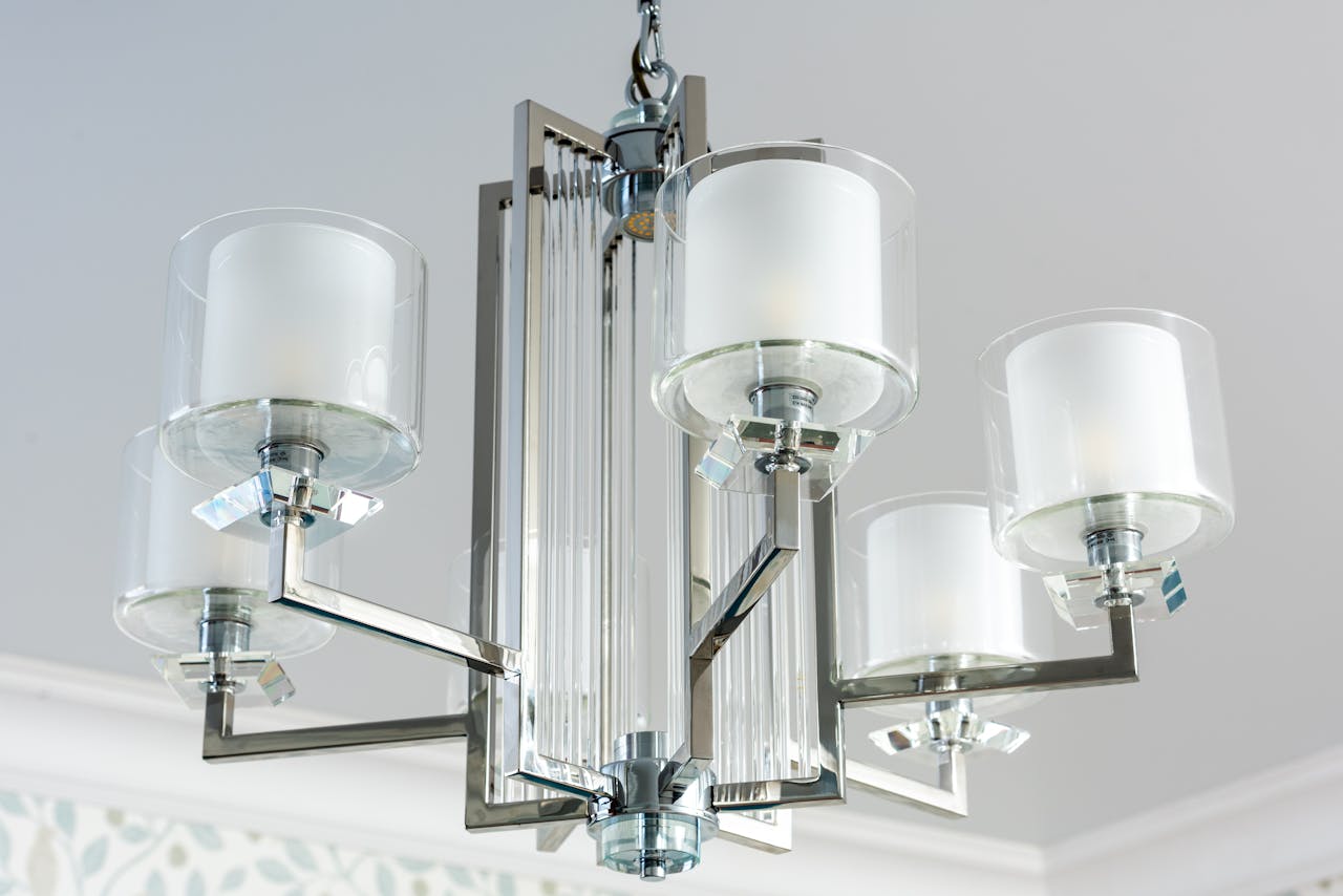 Low angle of creative design of lamp made of glass and metal materials in house room